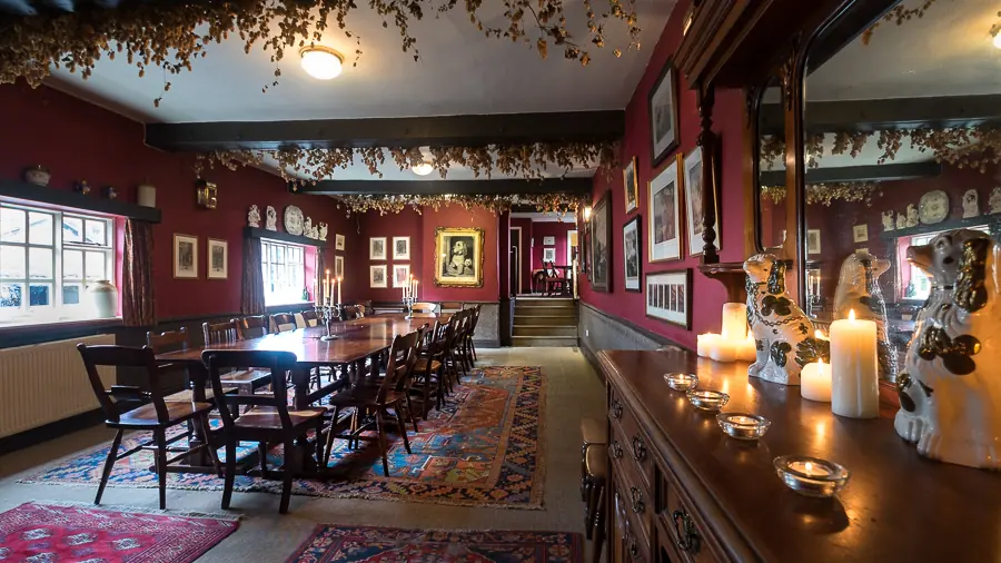 The upstairs function room at The Eagle and Child, laid for a party